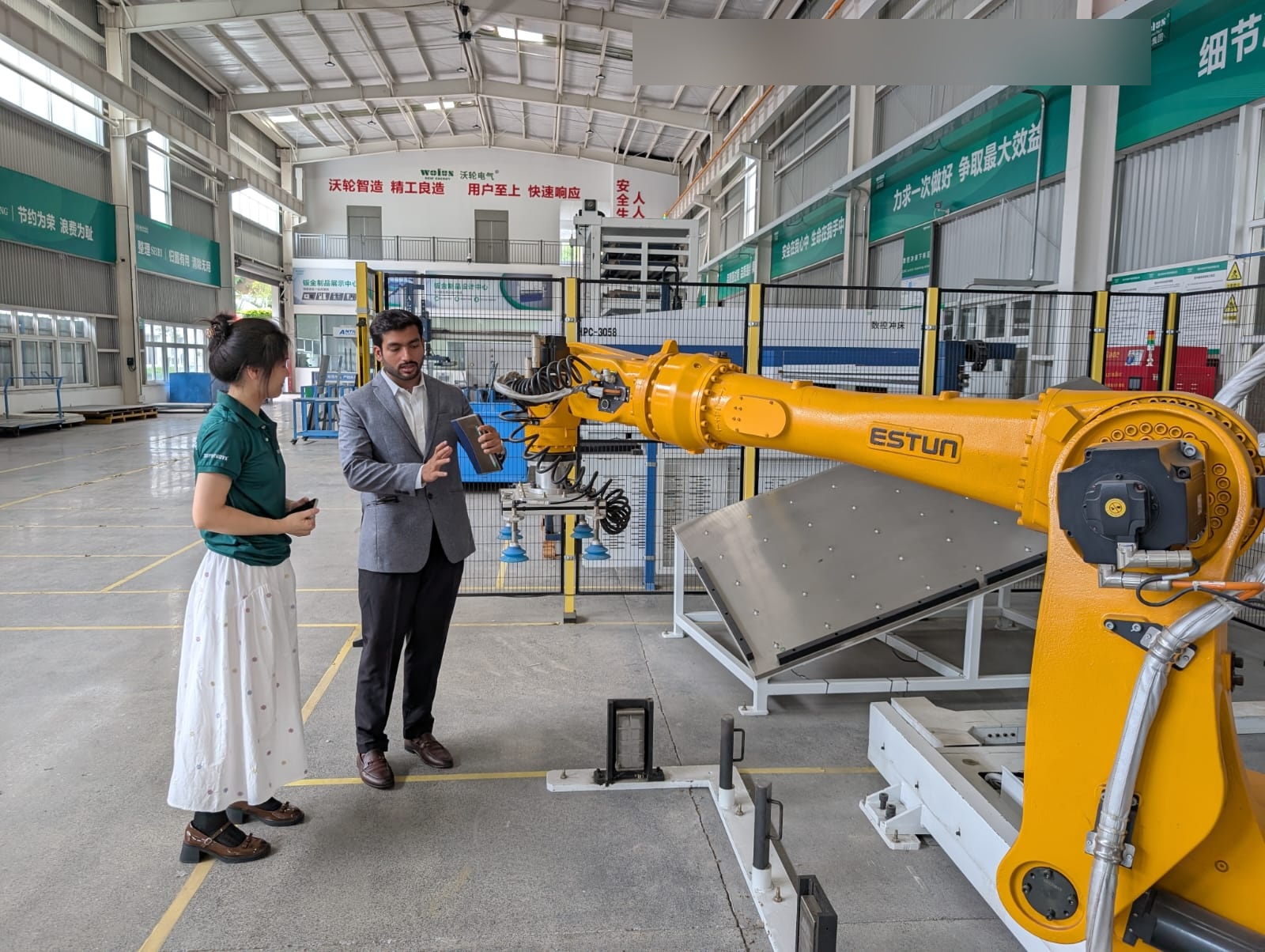 Charginity team member discussing industrial automation during a China facility visit